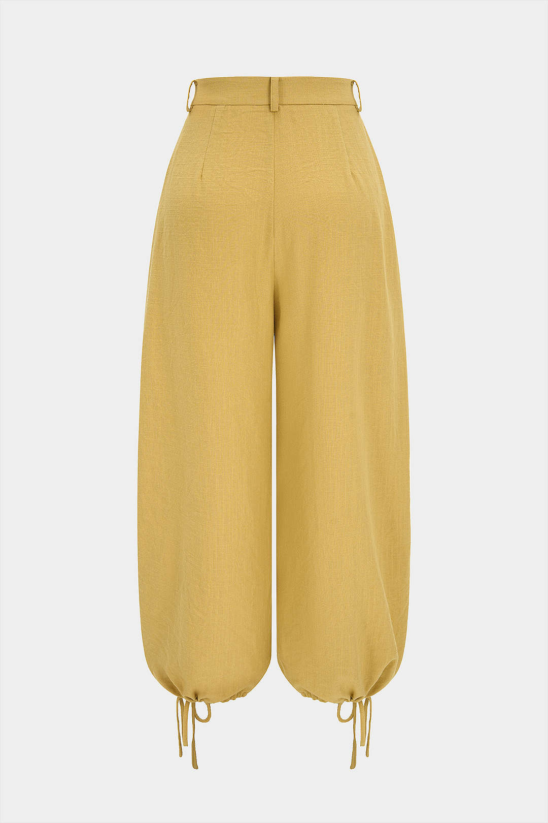 Broek met knoopjes, zakken en strik