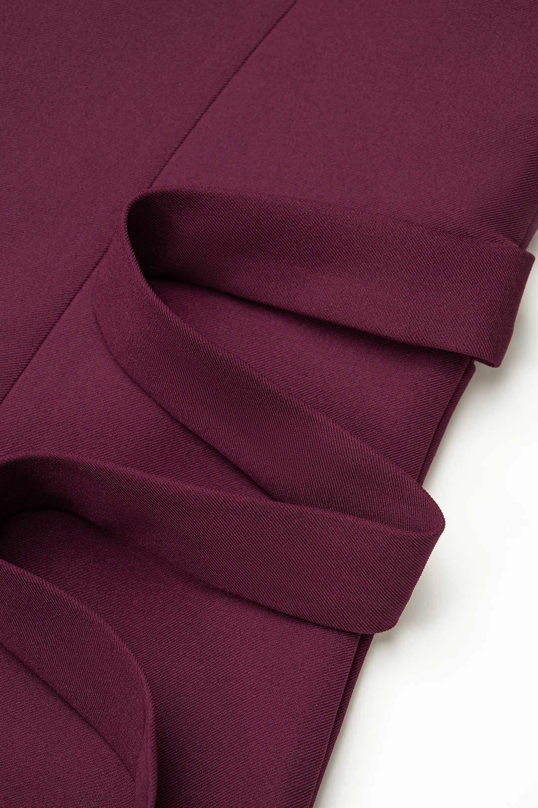 Asymmetrisch gilet met reverskraag en knoopjes