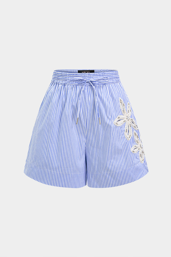 Asymmetrische short met borduursel, strass en strik
