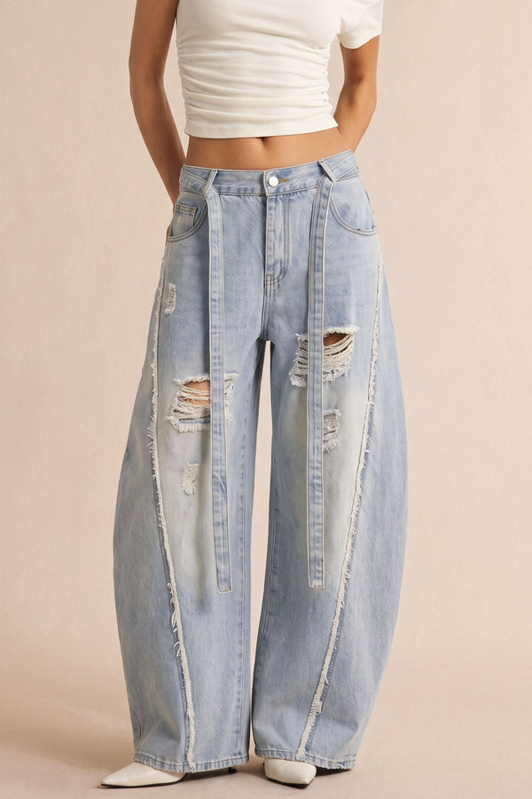 Ripped jeans met rafelrand en riem
