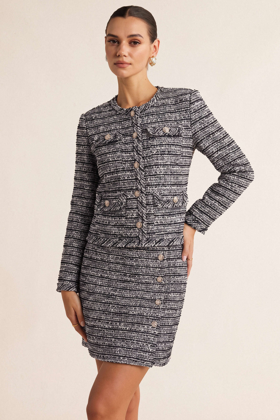 Asymmetrische metallic minirok met knoopjes en hoge taille