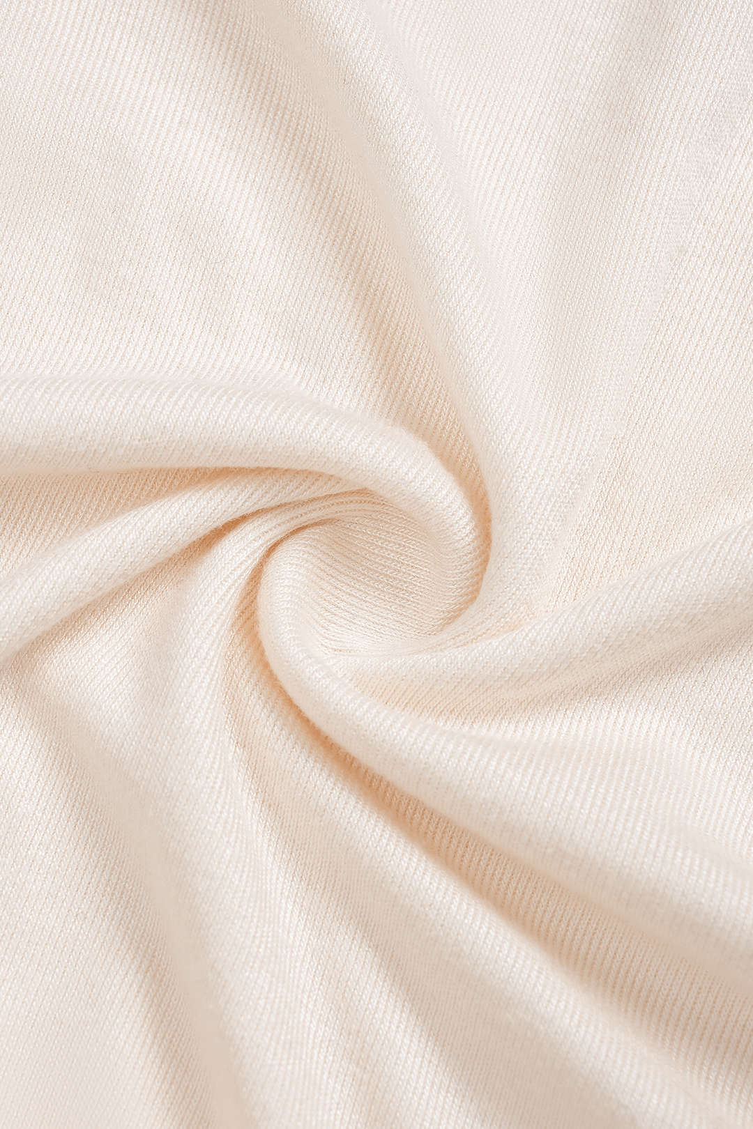 Asymmetrische body met knoopjes, ruches en lange mouwen