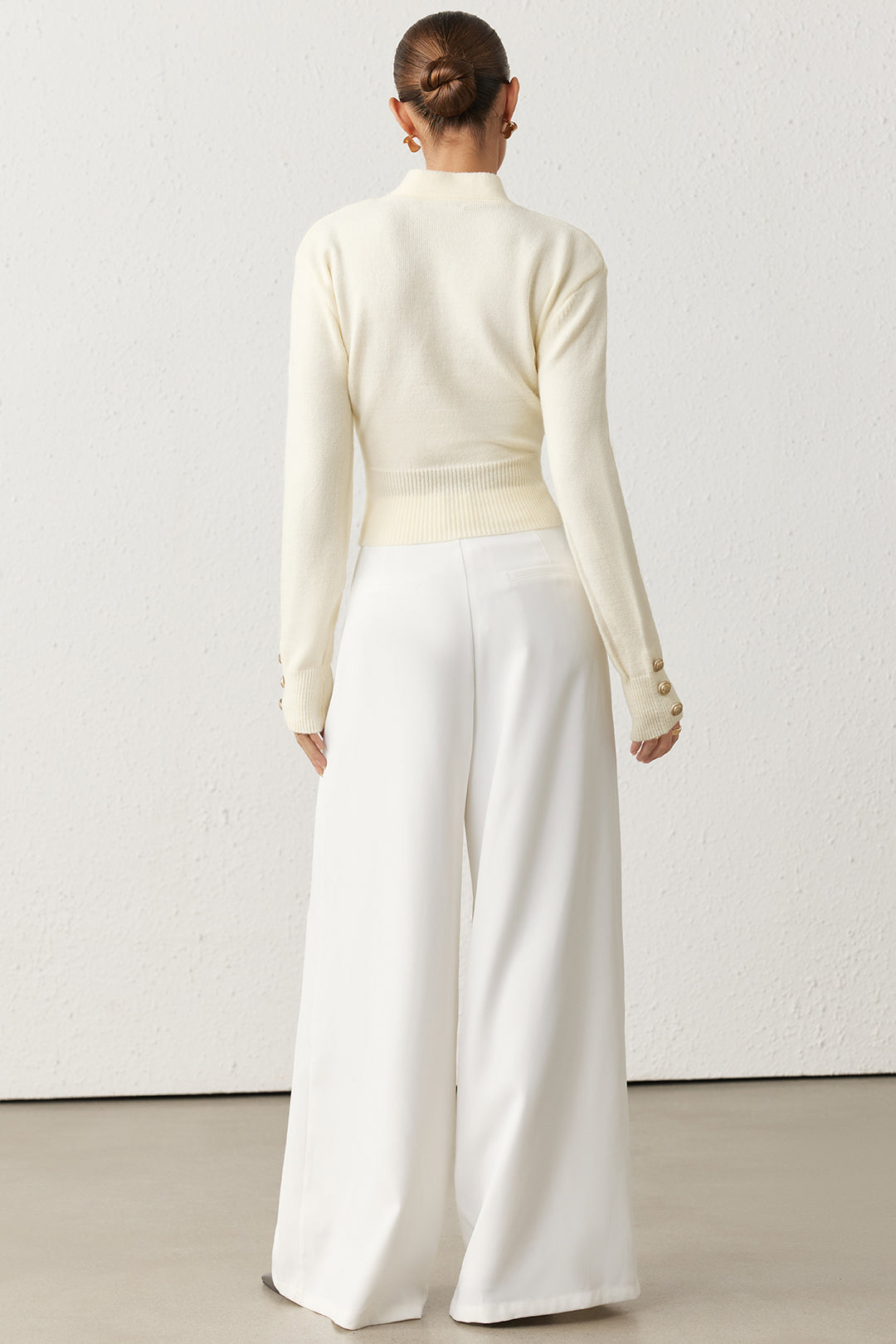 Asymmetrische metallic top met knoopjes en strik