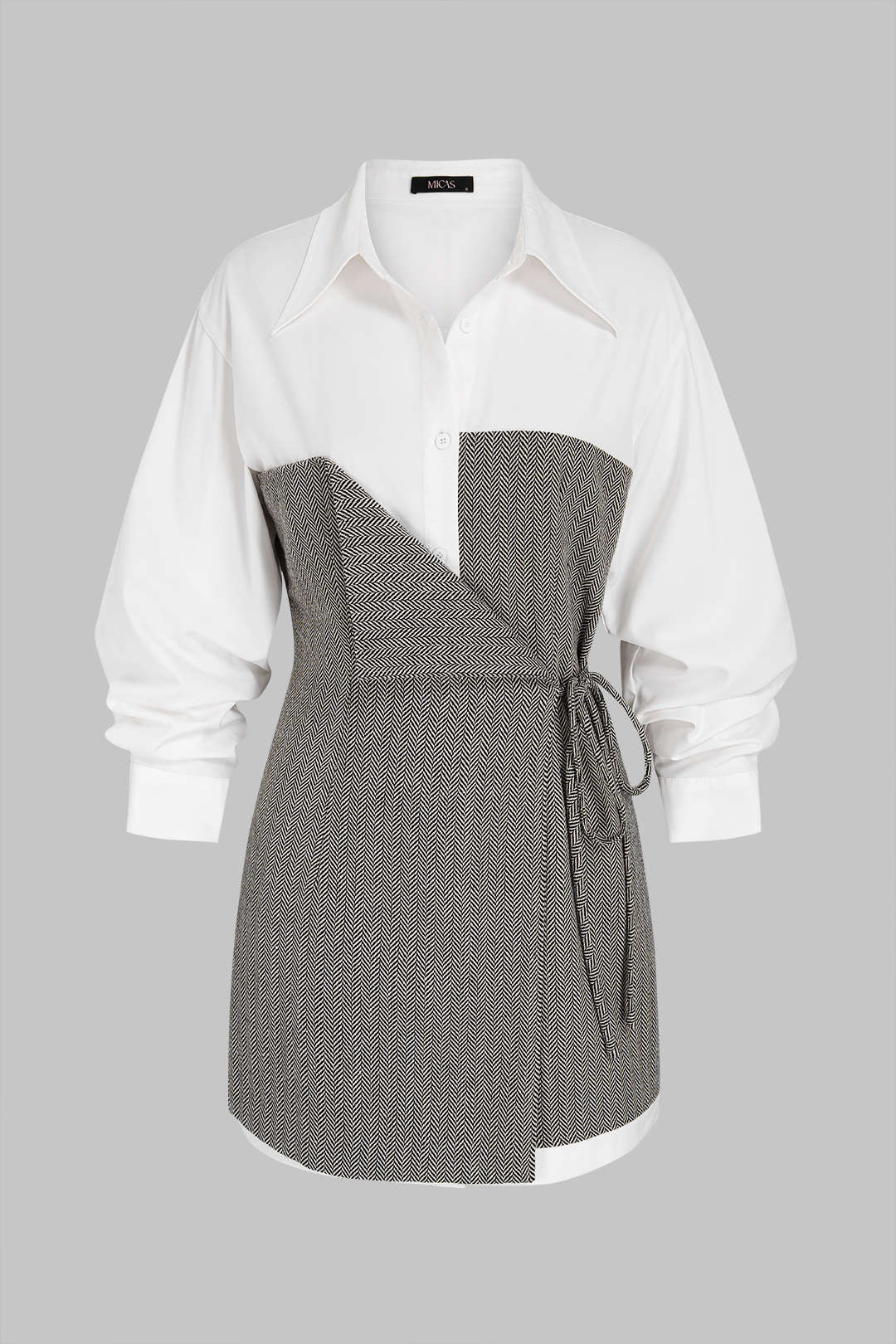 Geometrische patchwork minijurk met strik en lange mouwen