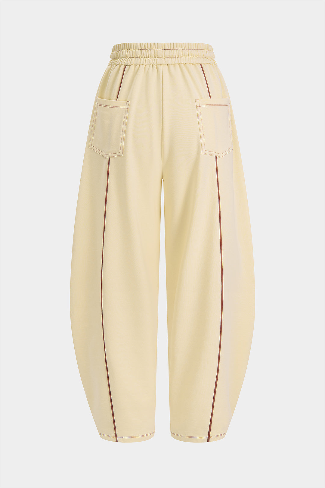 Broek met smokwerk, trekkoord en wijde pijpen