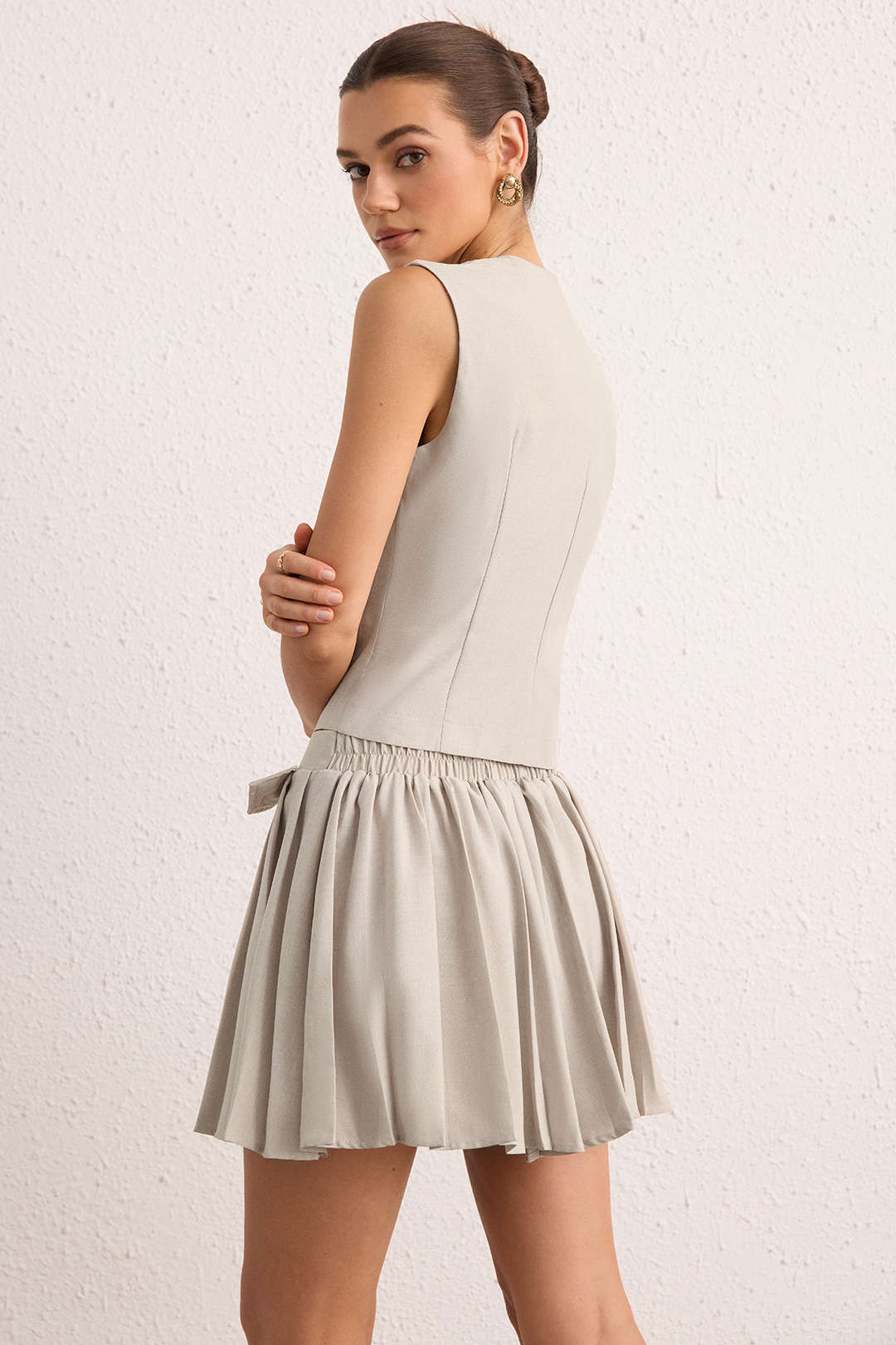 Geplooide set met gilet en rok