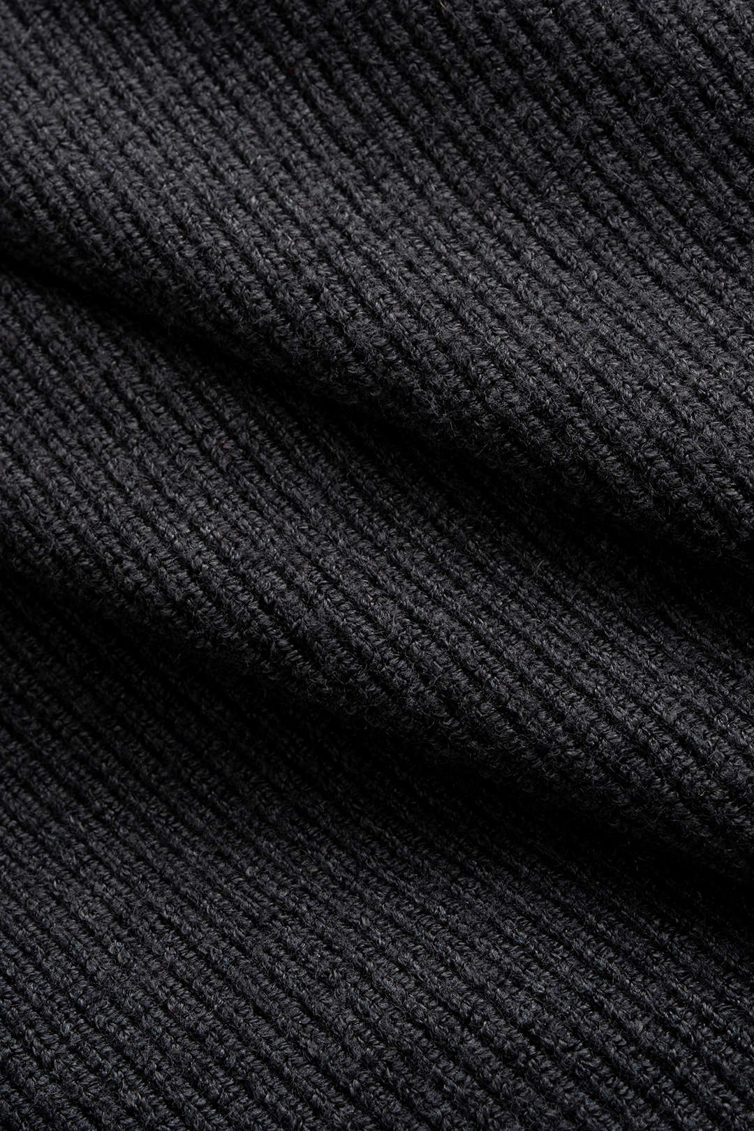 Floor - Gebreide asymmetrische top met riem en lange mouwen