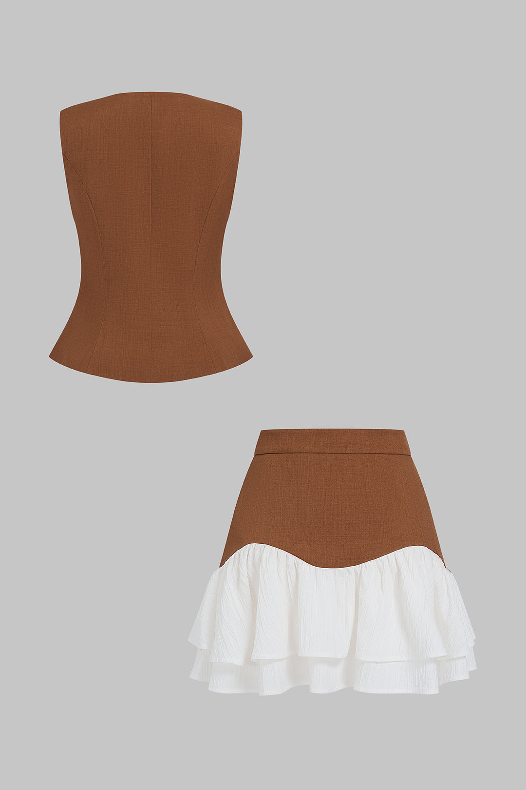 Asymmetrische set met gilet en minirok