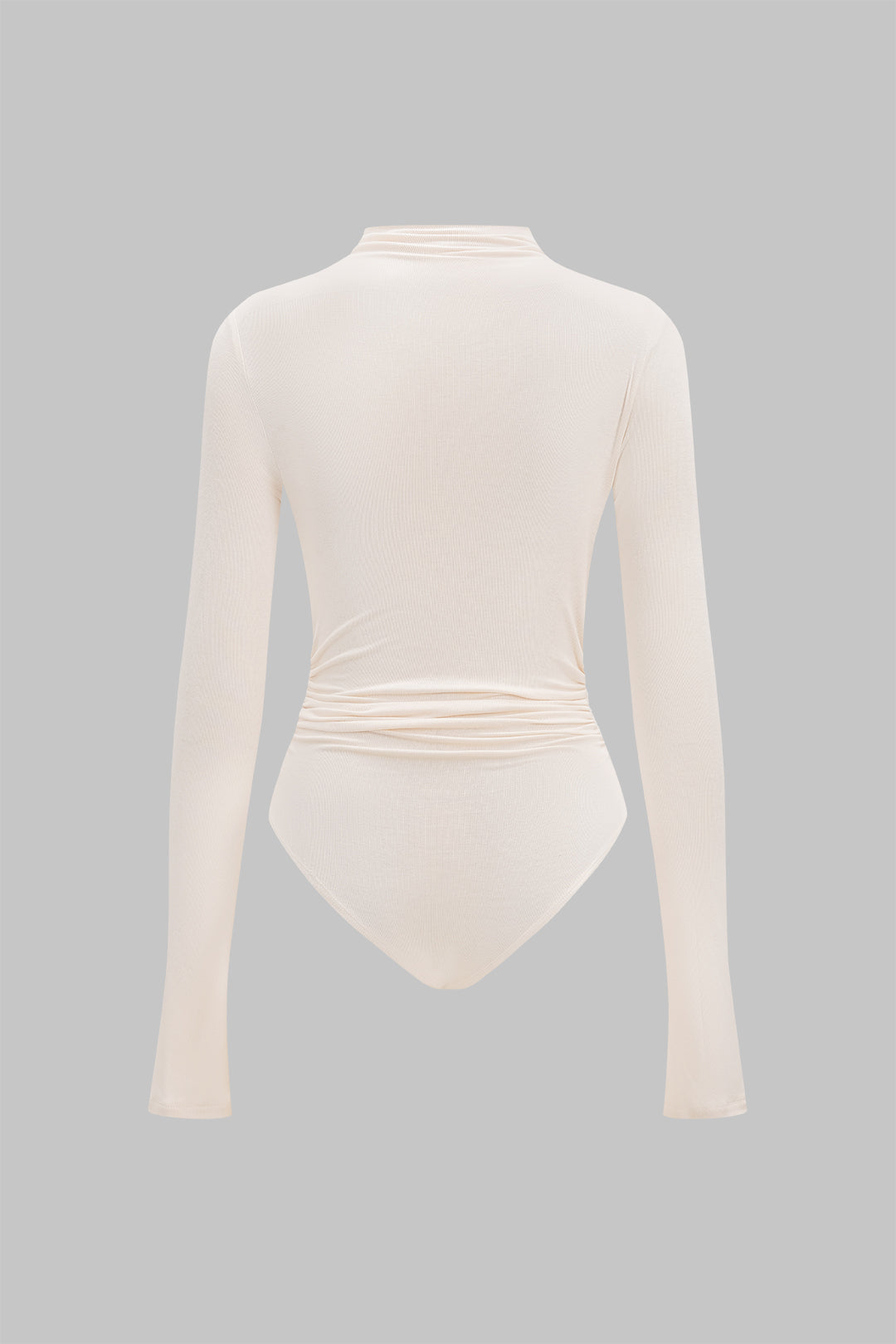 Asymmetrische body met knoopjes, ruches en lange mouwen