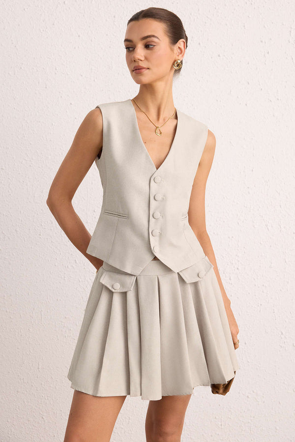 Geplooide set met gilet en rok