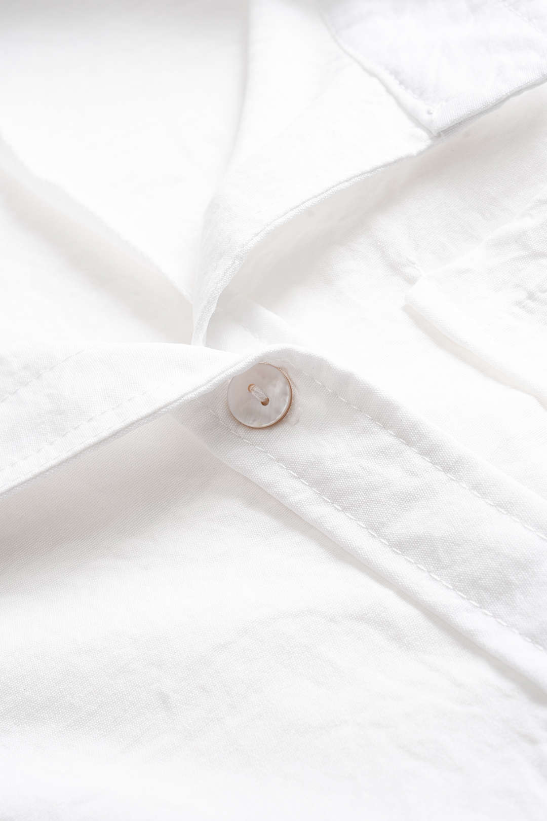 Mouwloze jumpsuit met revers, zakken en knoopjes