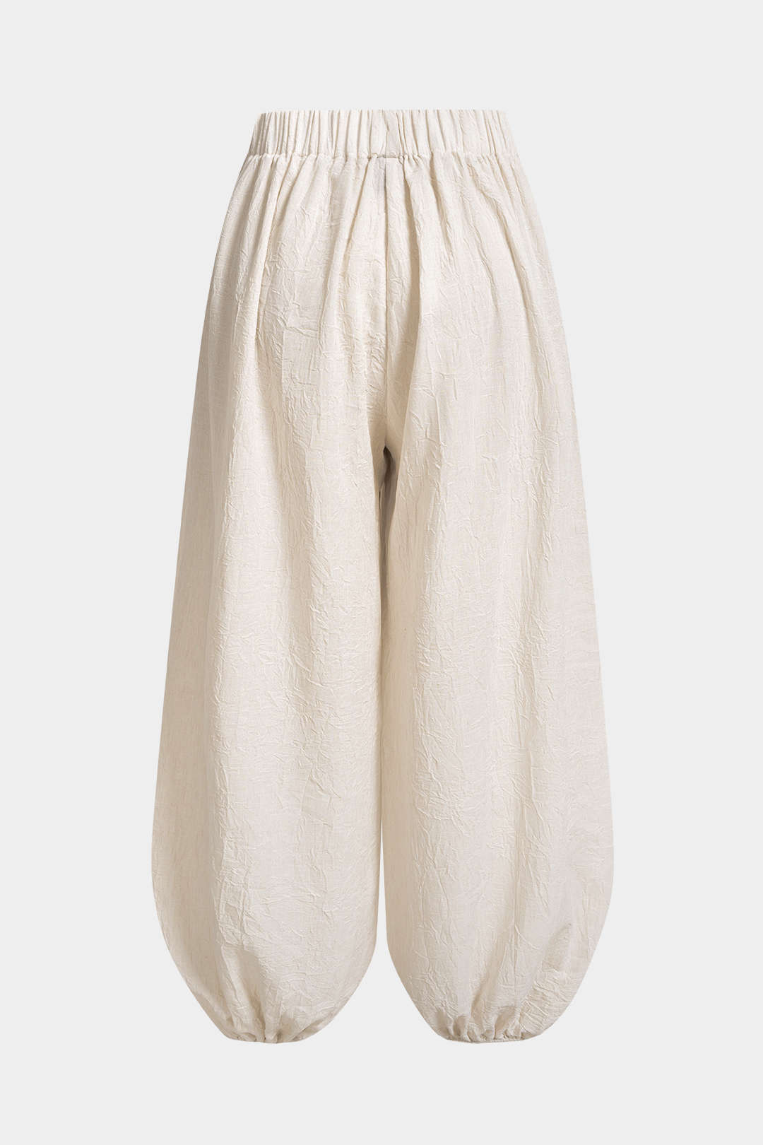 Asymmetrische broek met knoopjes, ruches en wijde pijpen