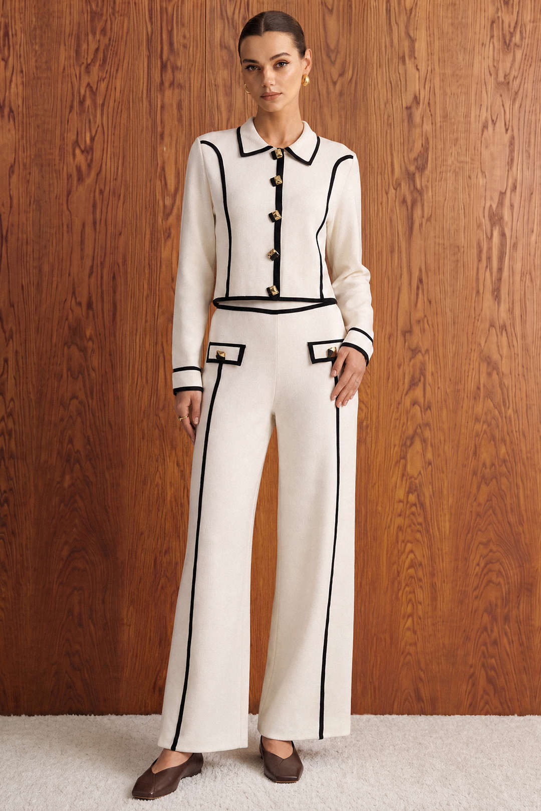 Gebreide metallic top met knoopjes en lange mouwen