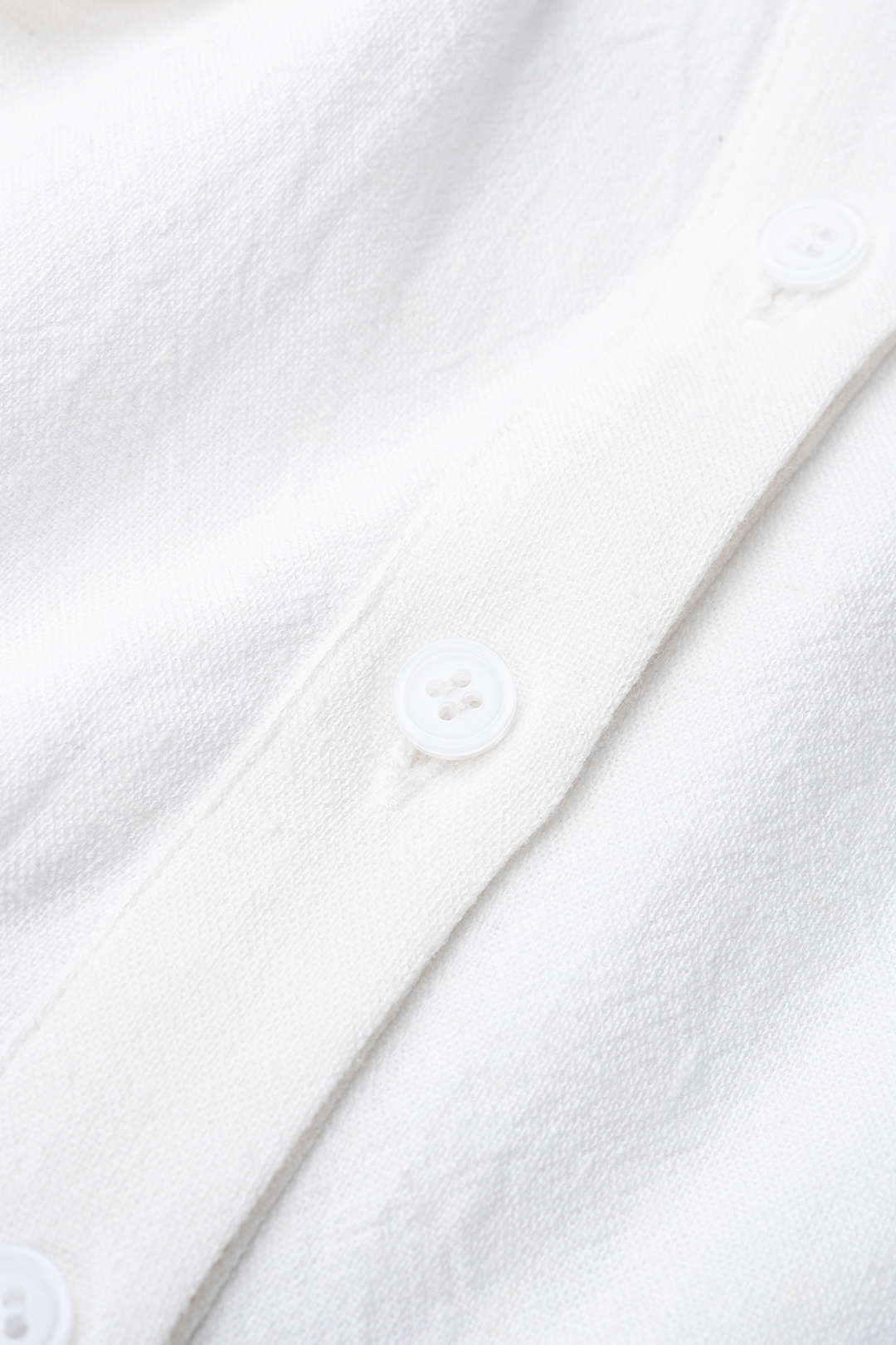 Mouwloze playsuit met ruches en strik
