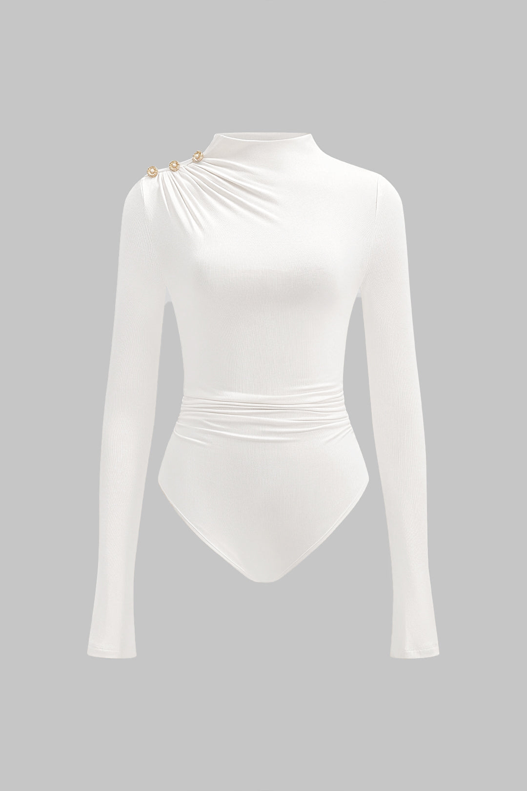 Asymmetrische body met knoopjes, ruches en lange mouwen