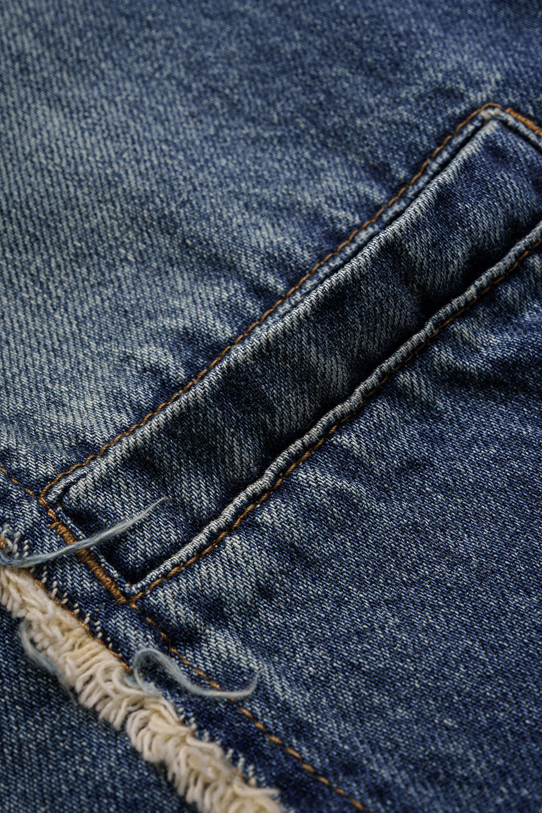 Asymmetrische jeans met franjes en zakken