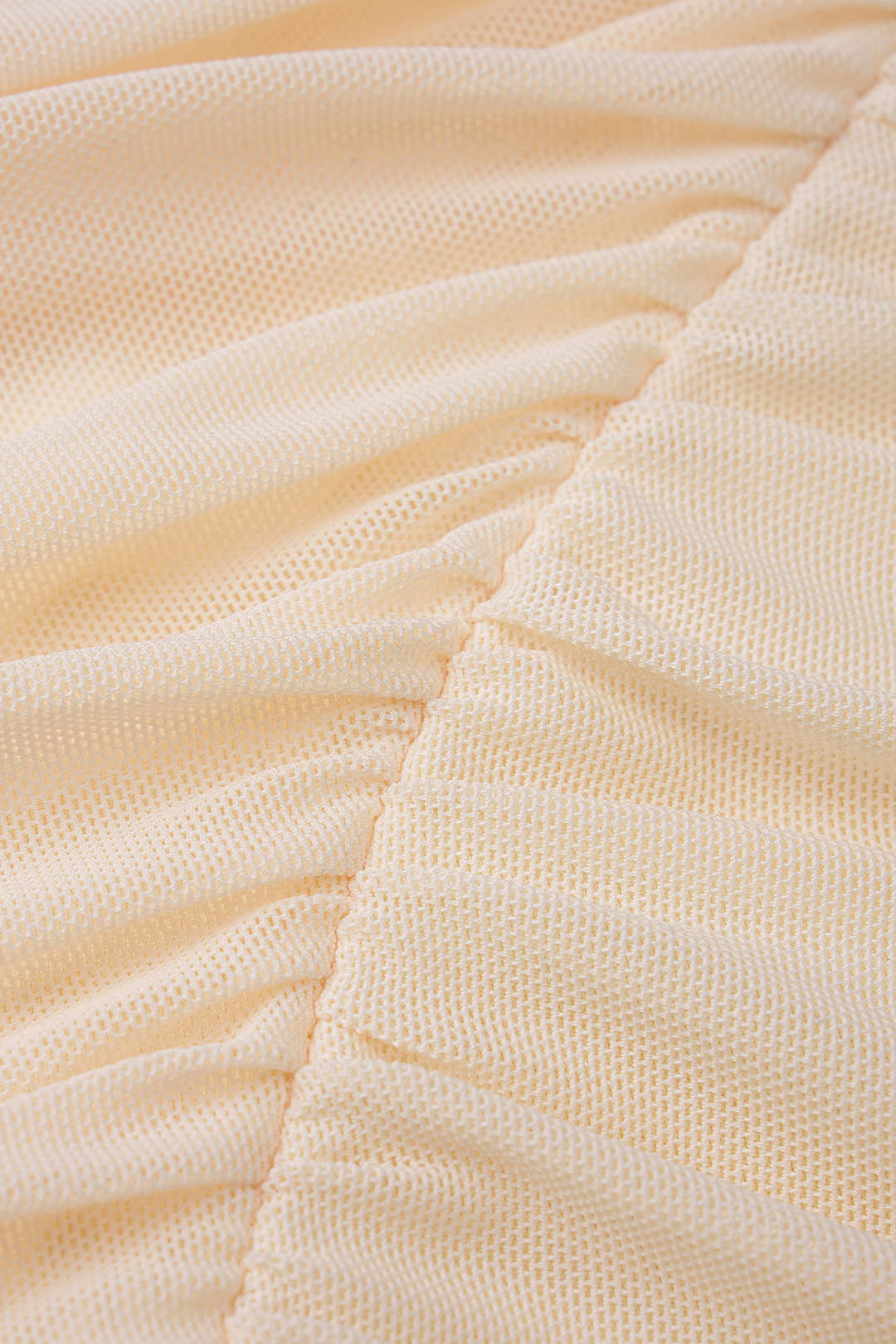 Mesh mouwloze minijurk met halternek, V-hals en strik