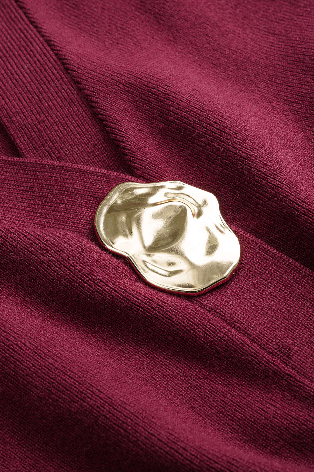 Gebreid metallic vest met knoopjes en lange mouwen