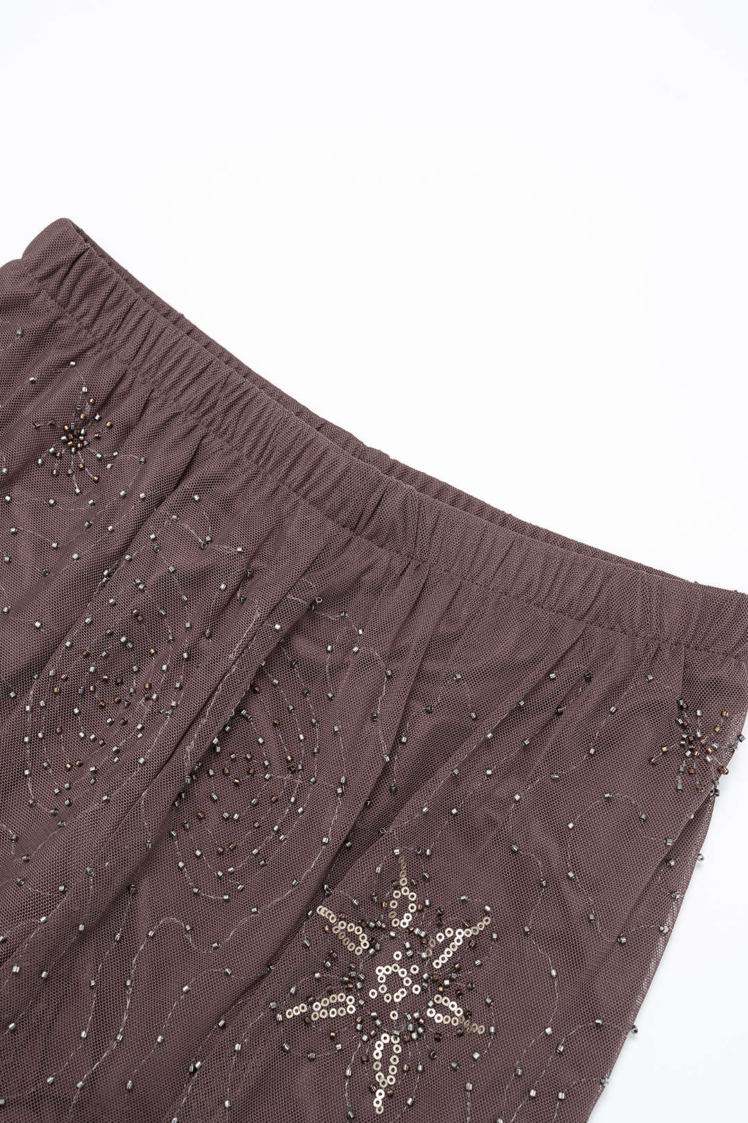 Mesh broek met kralen en smokwerk