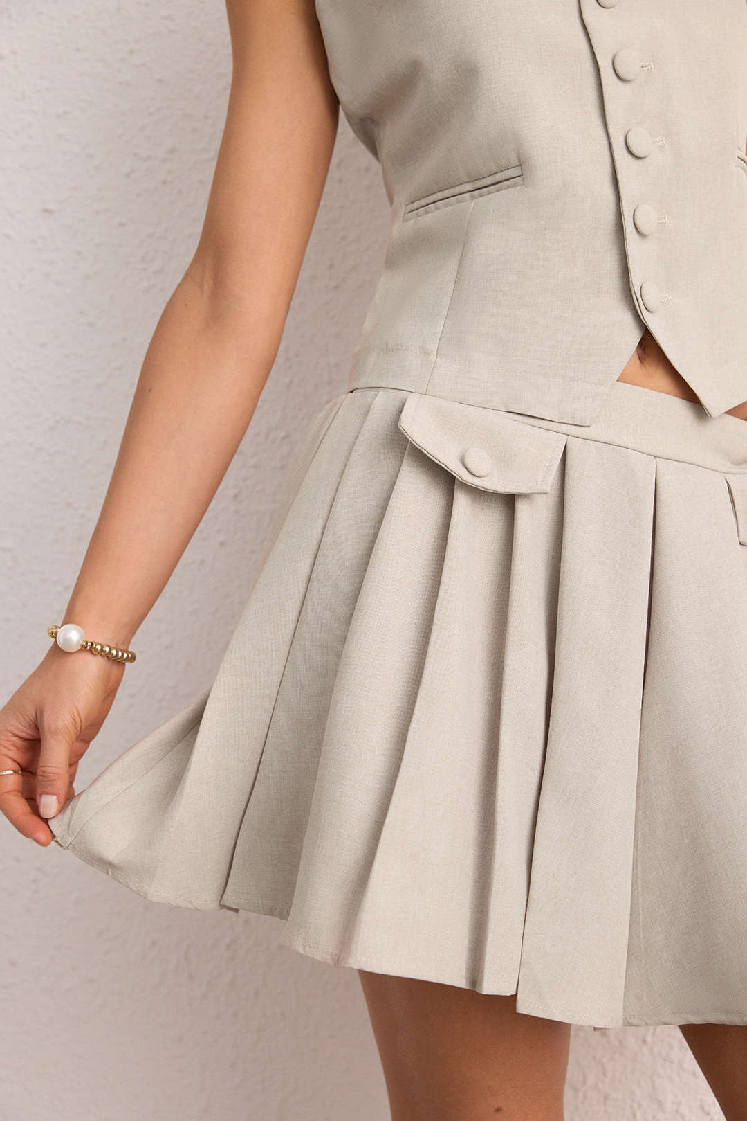 Geplooide set met gilet en rok