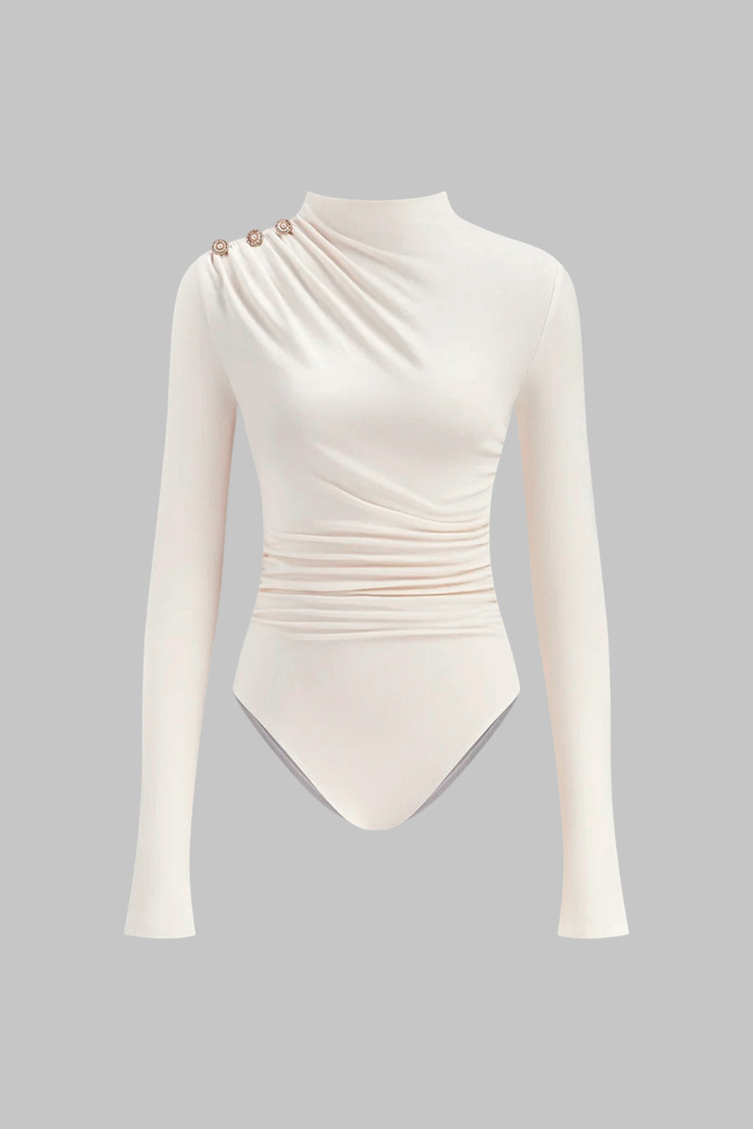 Asymmetrische body met knoopjes, ruches en lange mouwen