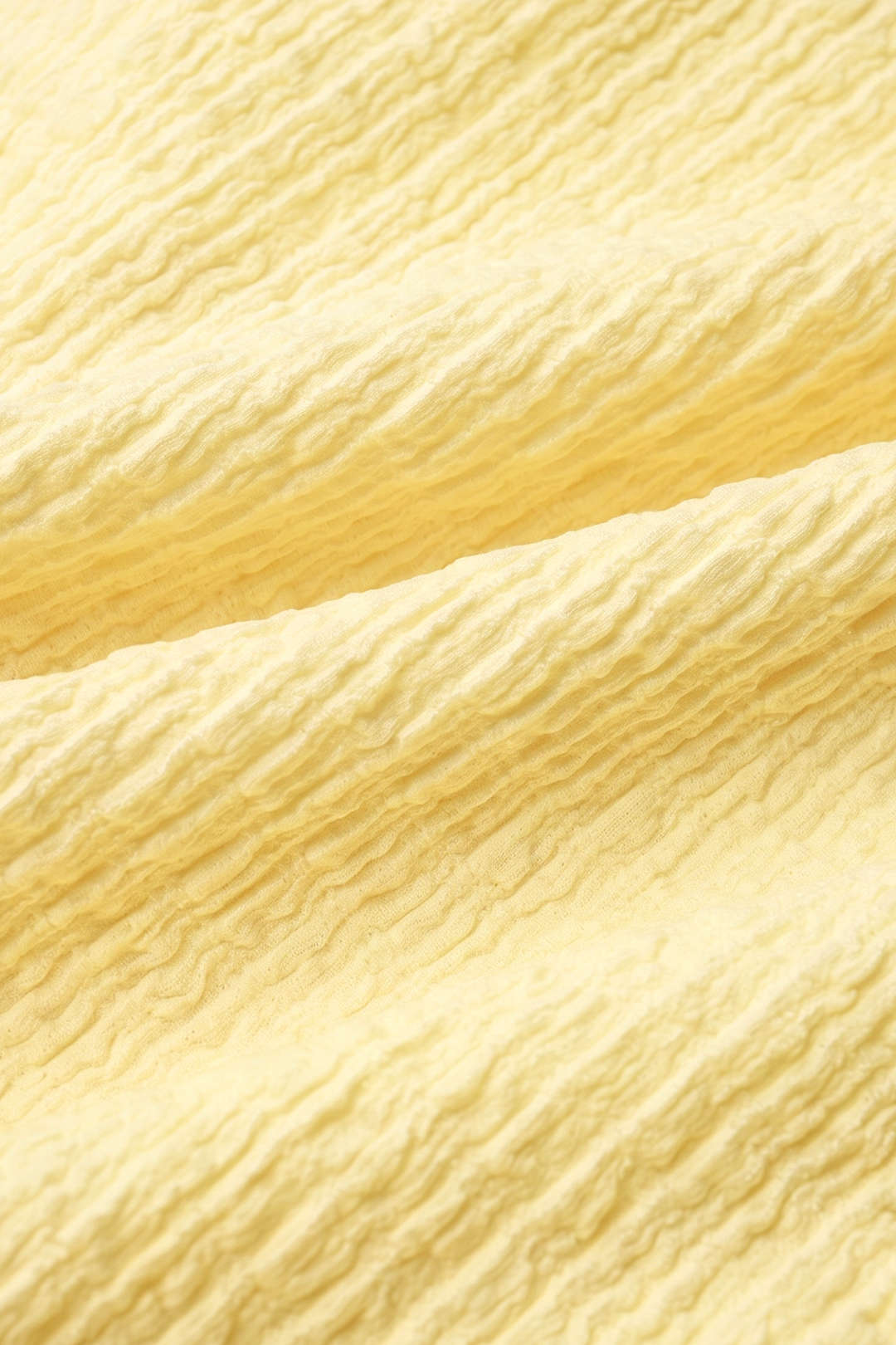 Mouwloze midijurk met franjes en spaghettibandjes