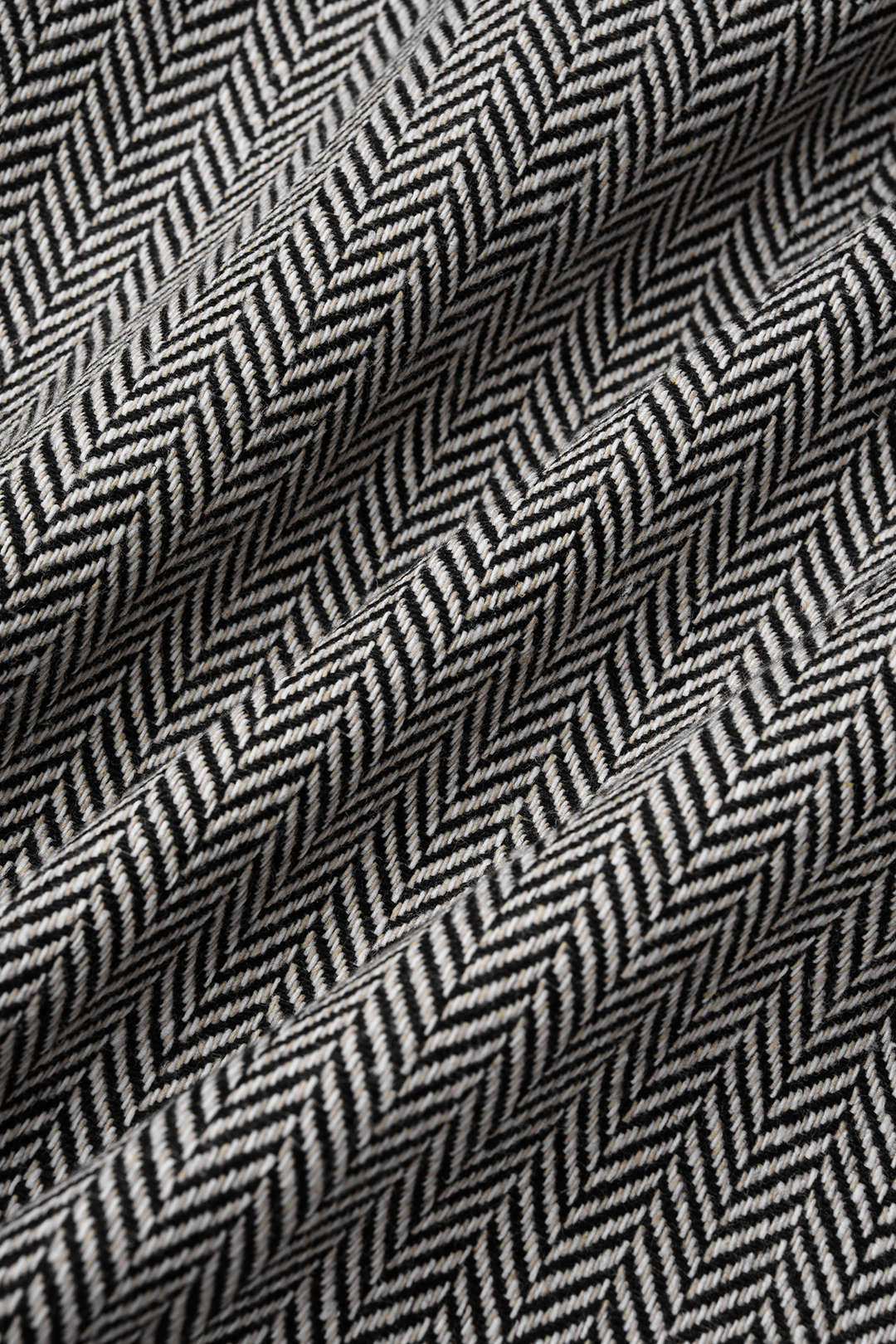 Geometrische patchwork minijurk met strik en lange mouwen
