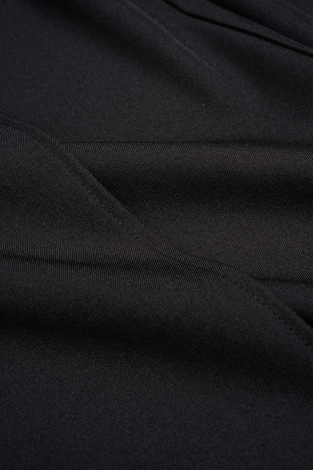 Asymmetrische broek met kanten rand en wijde pijpen