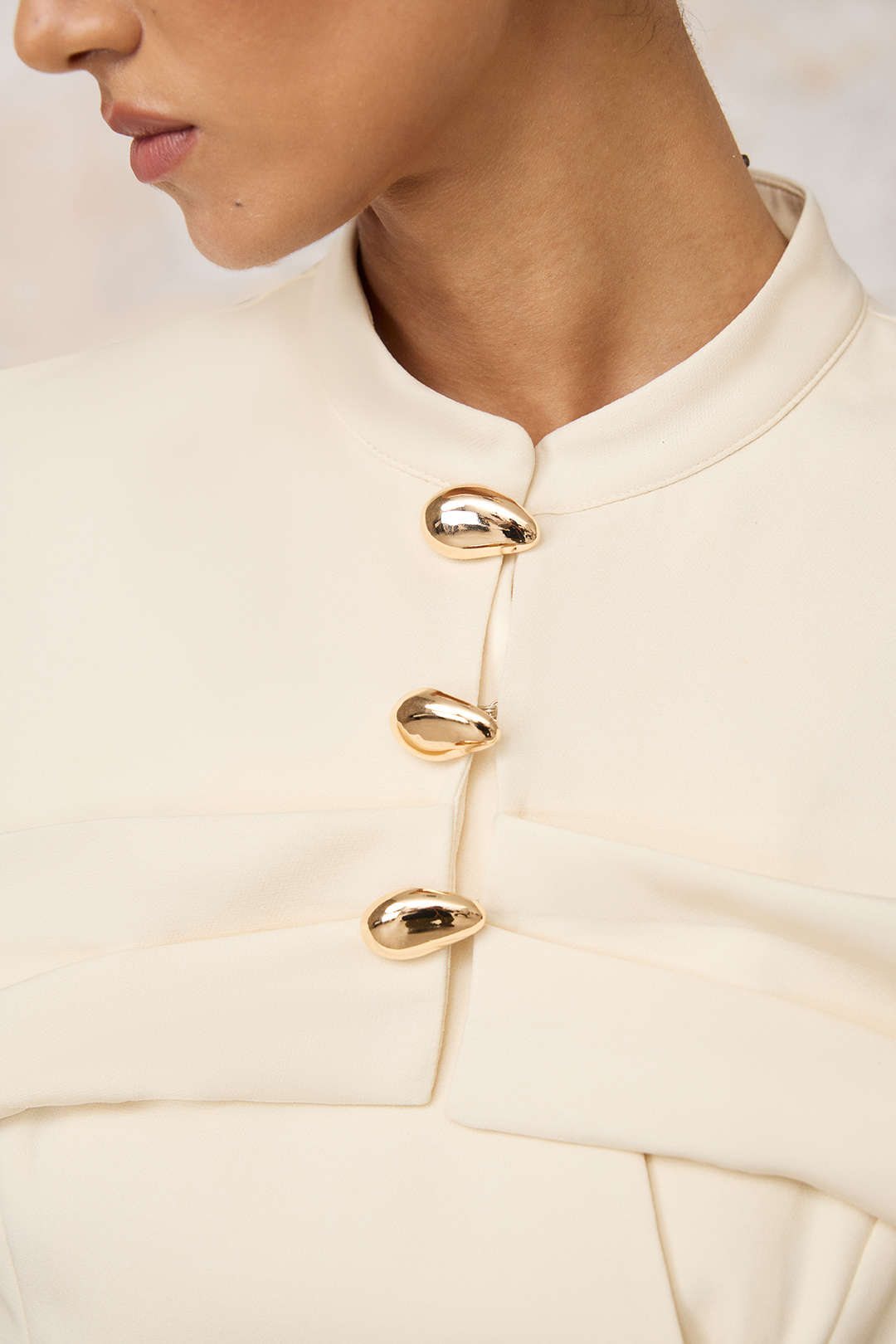 Metallic jasje met knoopjes
