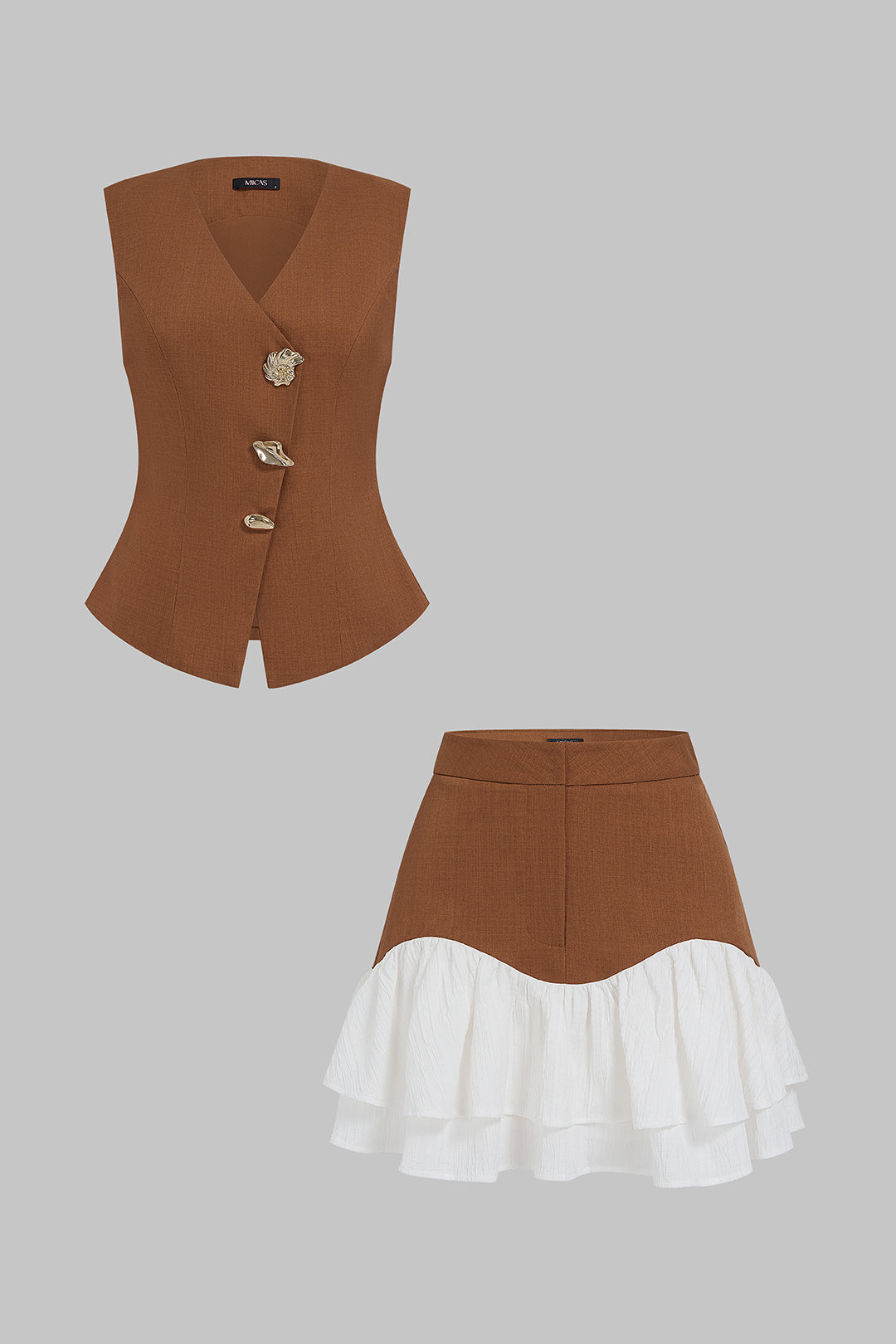 Asymmetrische set met gilet en minirok