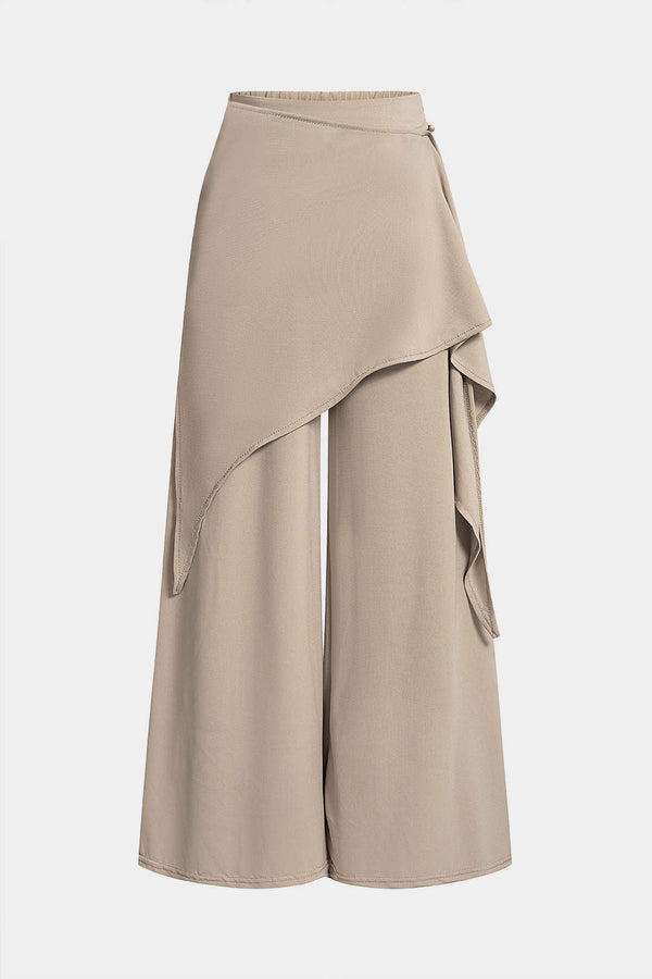 Asymmetrische broek met ruches, strik en wijde pijpen
