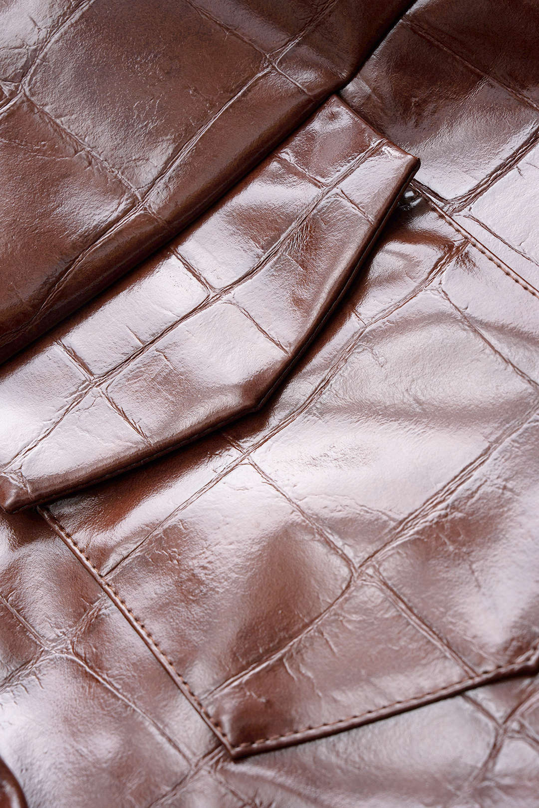 Leren-look cropped jasje met zakken