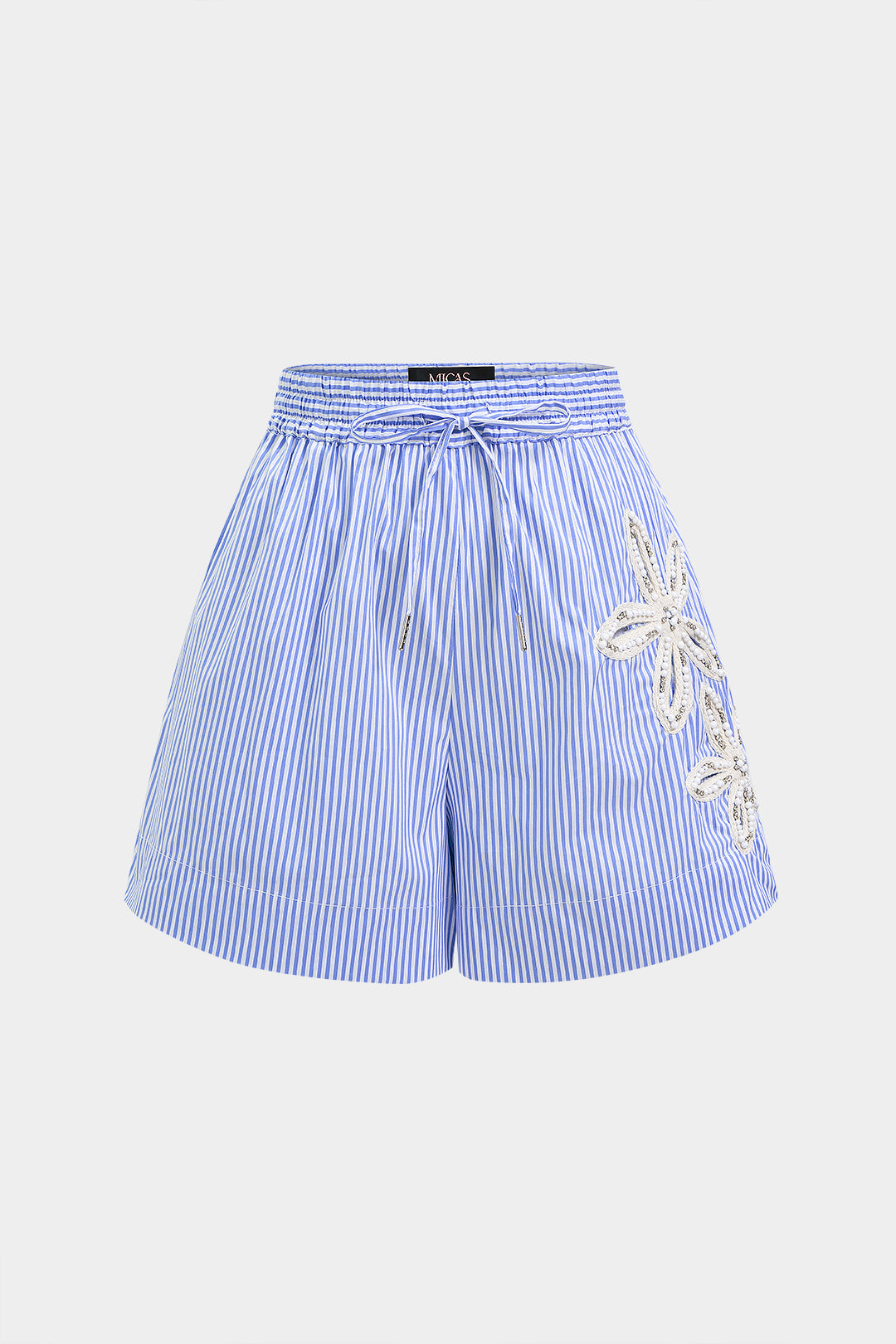 Asymmetrische short met borduursel, strass en strik