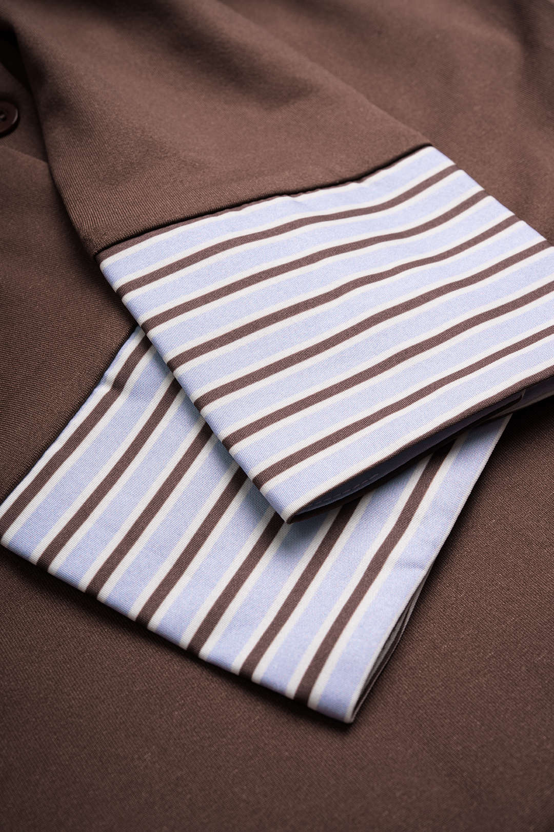 Patchwork gestreepte body met knoopjes en lange mouwen