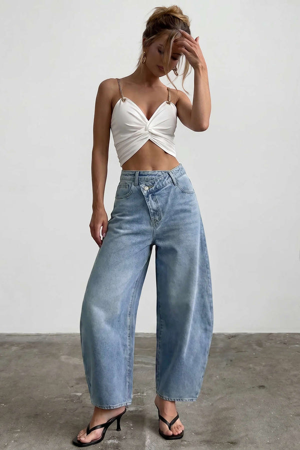 Asymmetrische jeans met knoopjes en ballonmodel