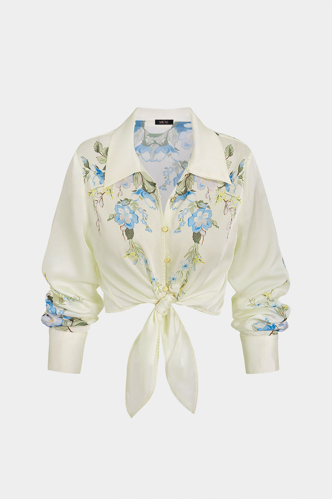 Bloemenprint metallic blouse met knoopjes en knoopdetail