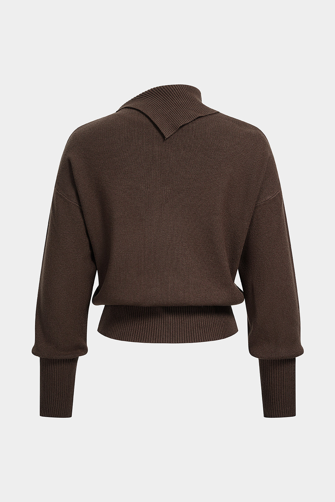 Gebreide asymmetrische top met knoopjes en lange mouwen