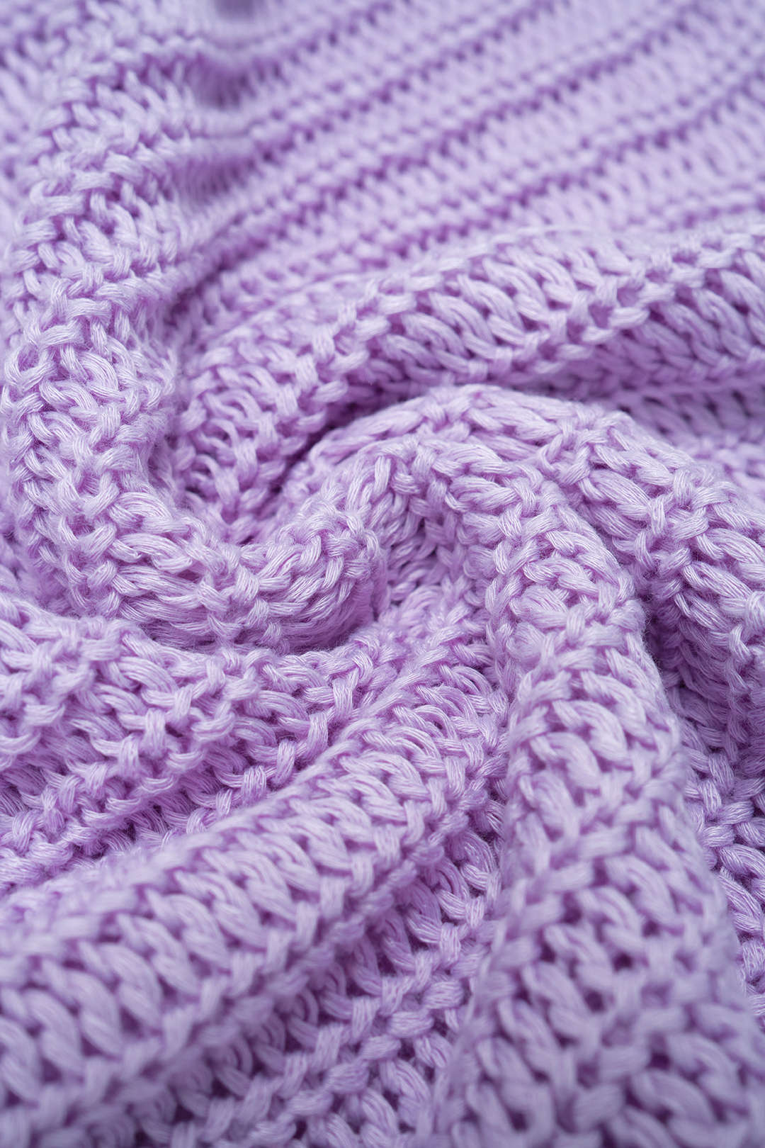 Nina - Gebreide mouwloze midijurk met ronde hals en franjes