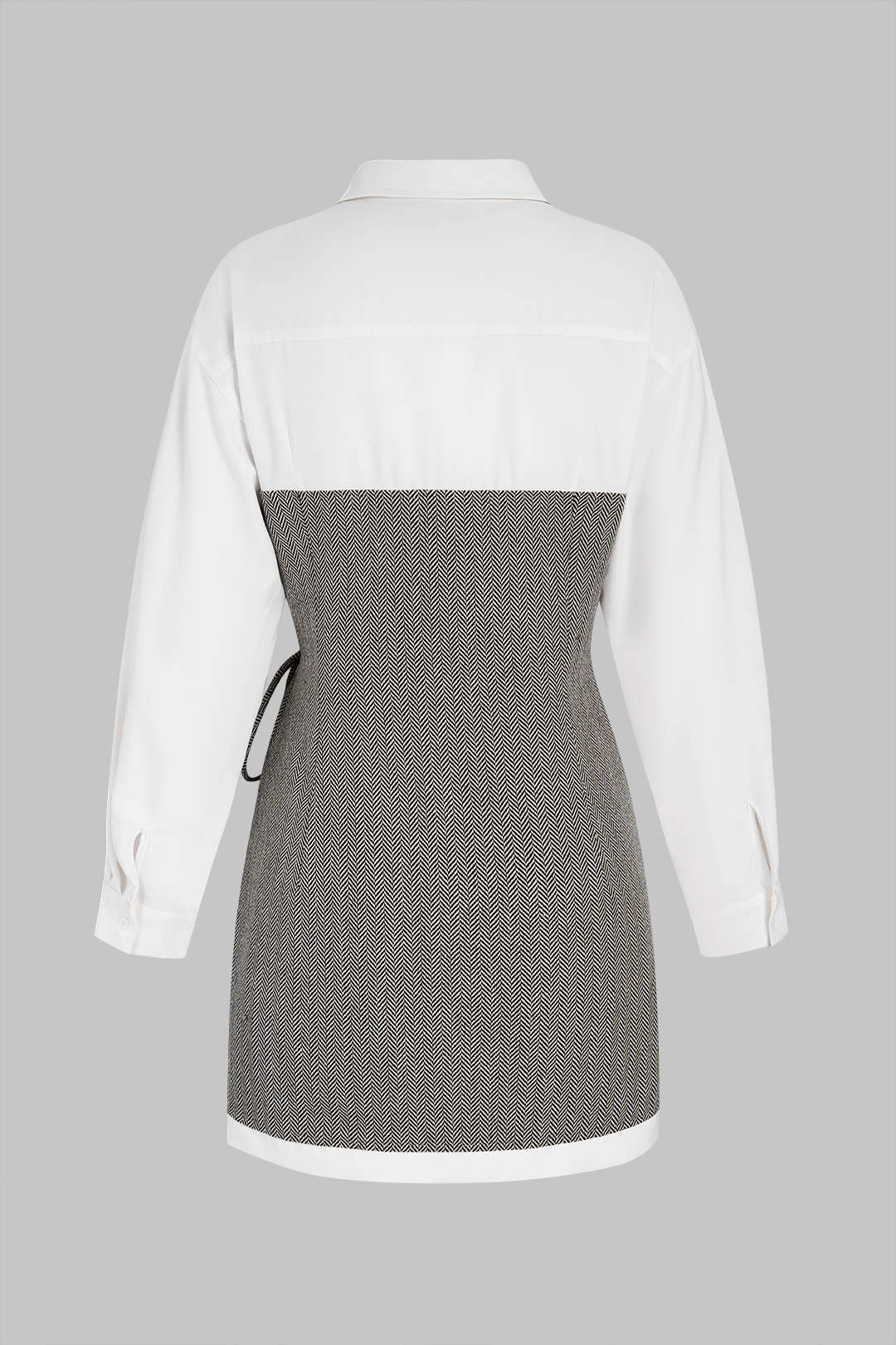 Geometrische patchwork minijurk met strik en lange mouwen
