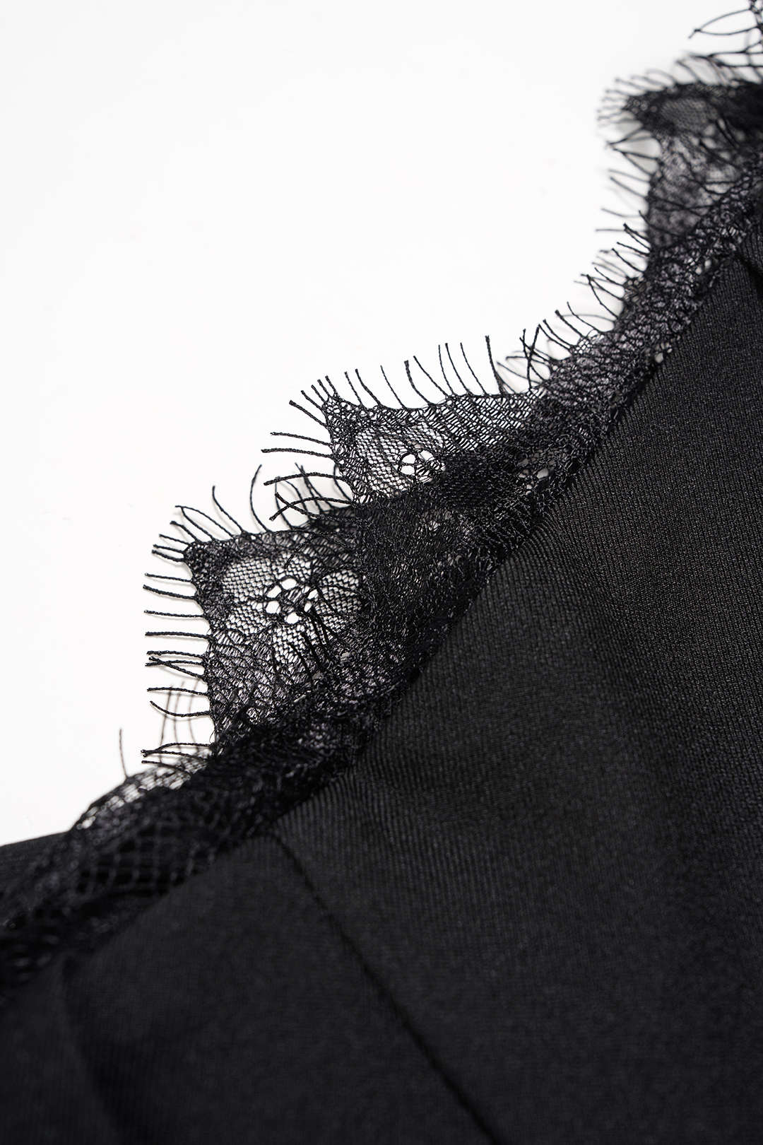 Asymmetrische broek met kanten rand en wijde pijpen
