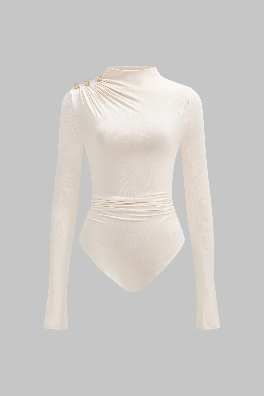 Asymmetrische body met knoopjes, ruches en lange mouwen