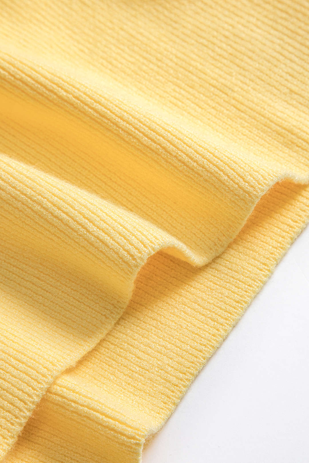 Gebreide metallic tanktop met knoopjes