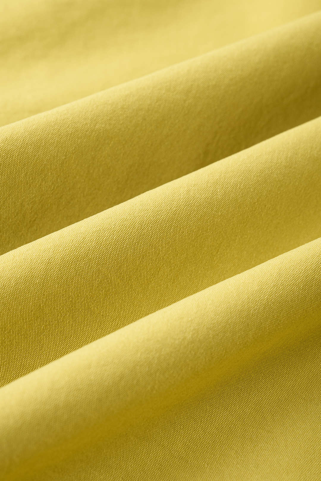Mouwloze midijurk met halternek en ruches