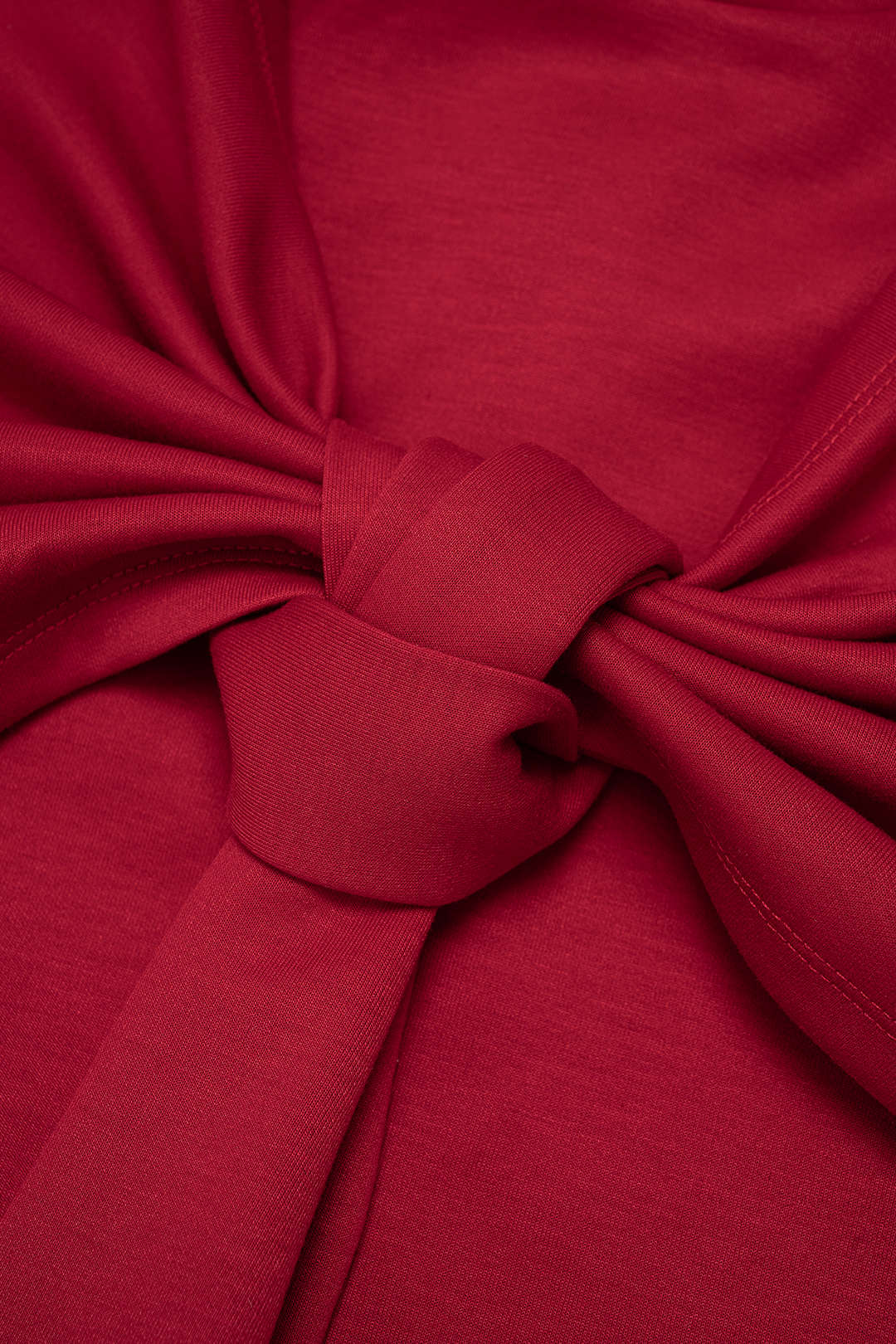 Mouwloze minijurk met knoopdetail en strapless pasvorm