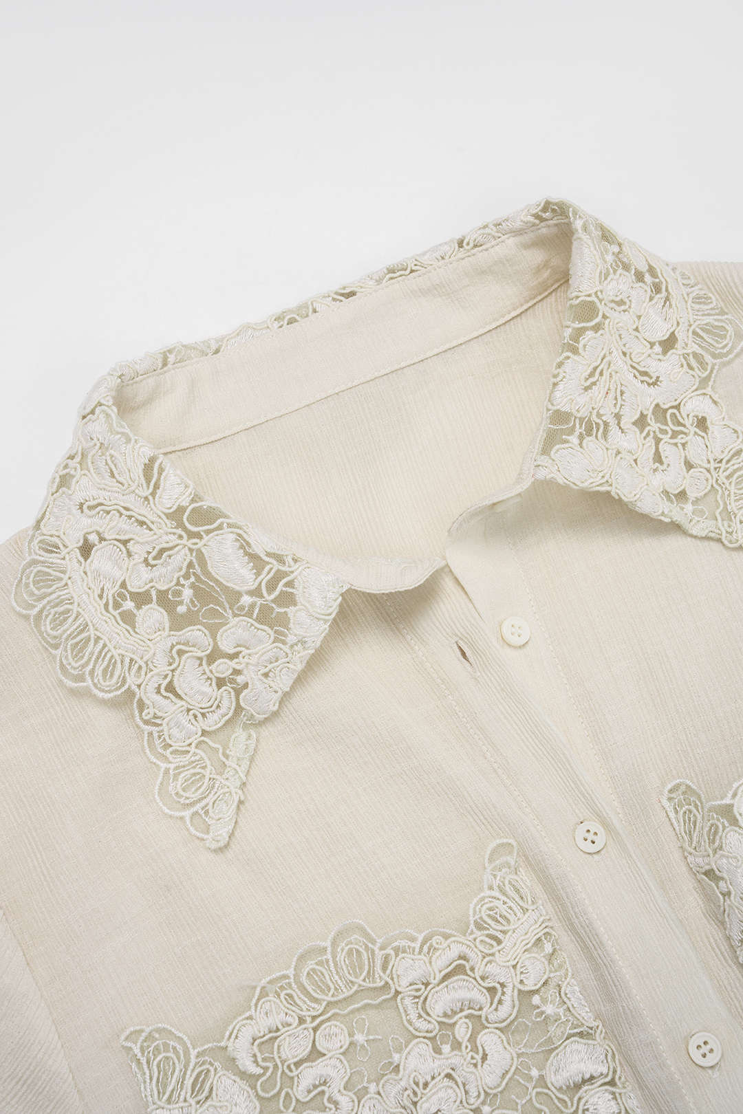 Patchwork jacquard body met revers, korte mouwen en zakken