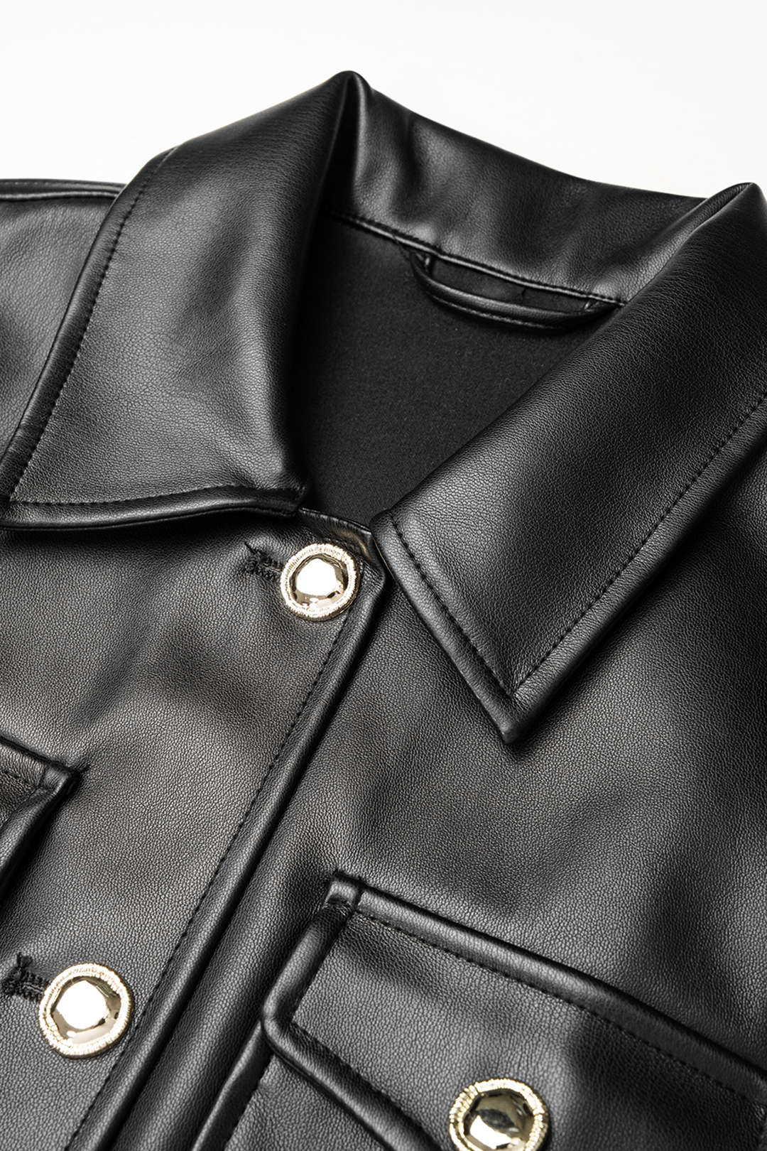 Leren-look mouwloze minijurk met knoopjes