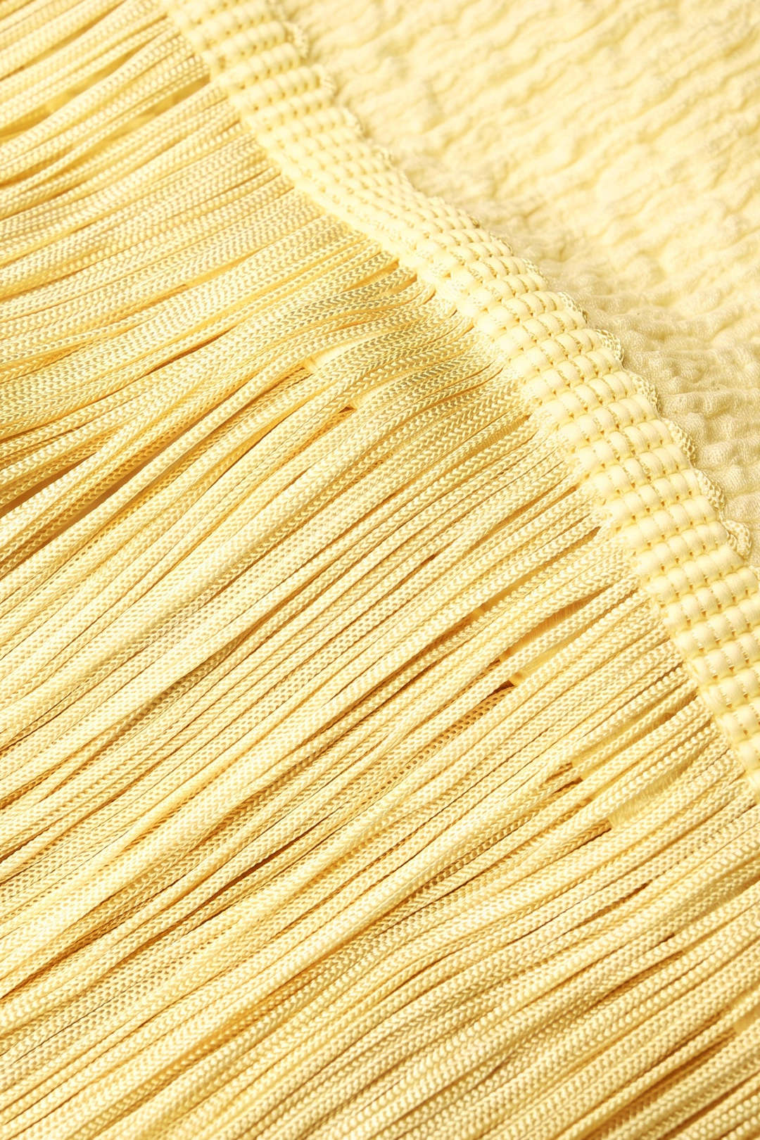Mouwloze midijurk met franjes en spaghettibandjes