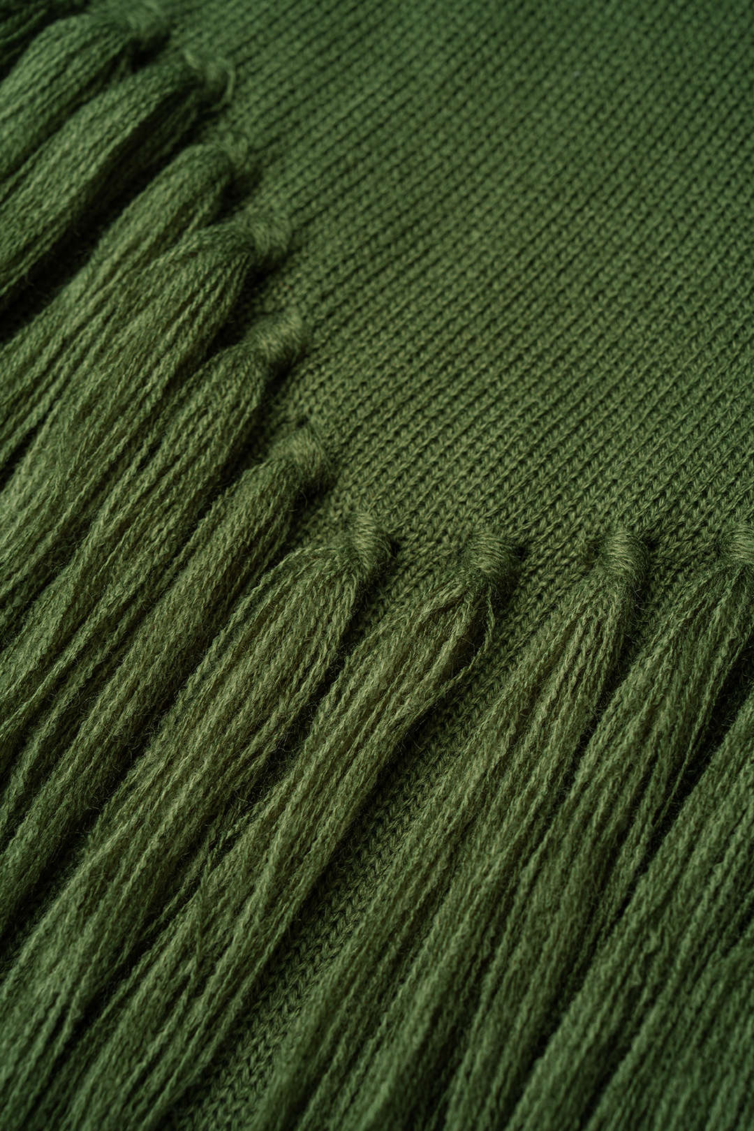 Gebreide mouwloze midijurk met franjes
