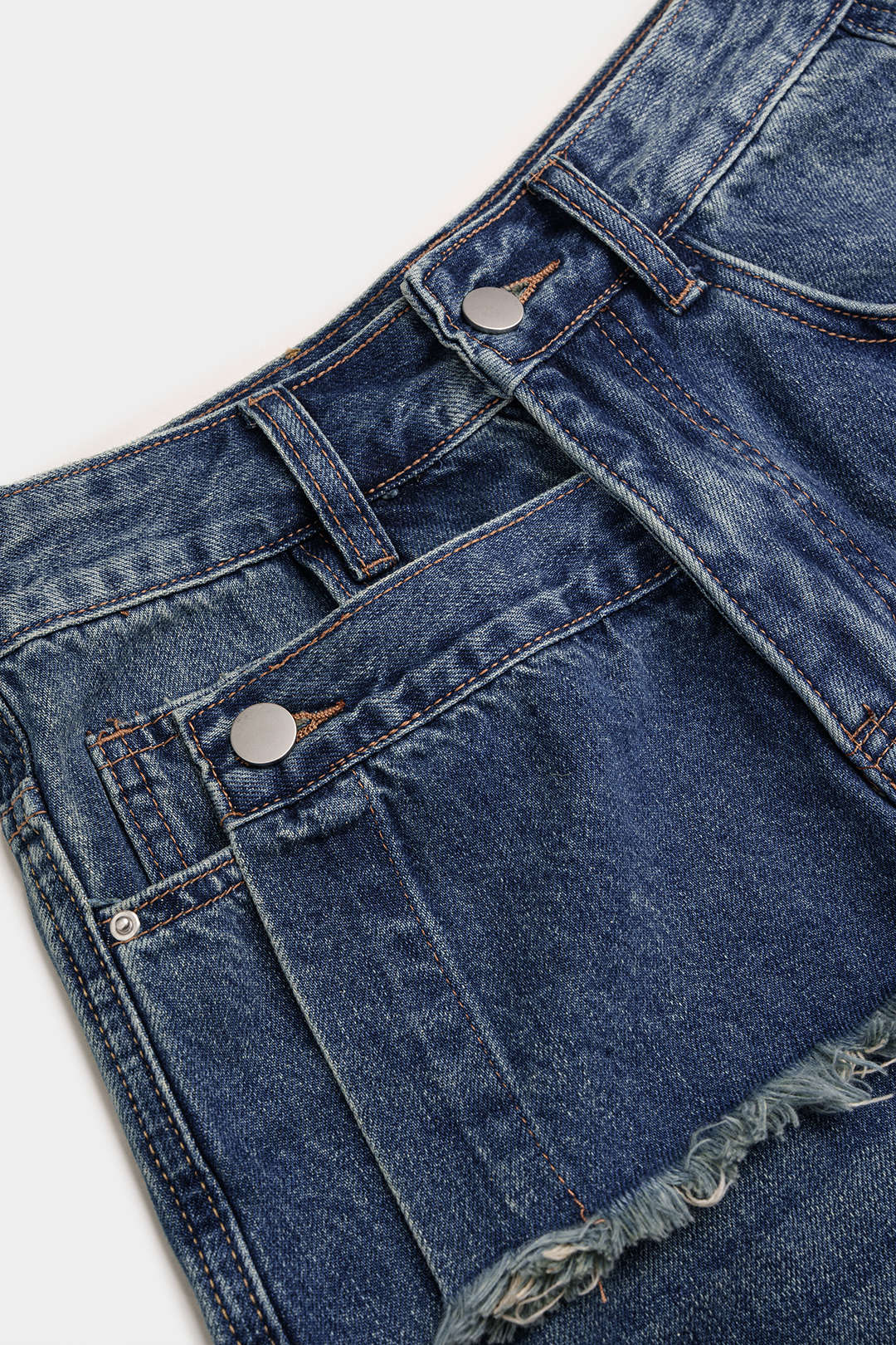 Denim asymmetrische short met rafelrand en wijde pijpen