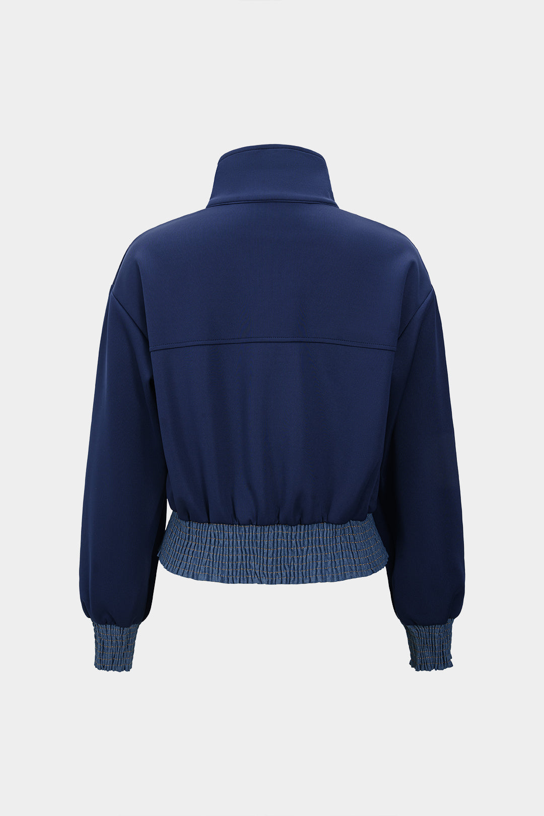 Denim patchwork jasje met smokwerk en rits